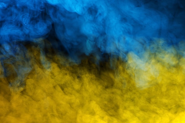 Photo abstrait texture de la fumée bleue et jaune arrière-plan