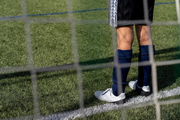 Action du gardien de but de football dans le stade