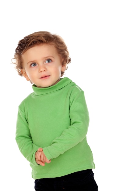 Adorable bébé avec une chemise verte