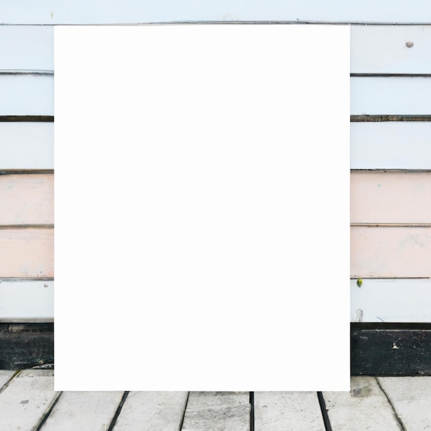 Photo une affiche blanche est contre un mur en bois avec un fond bleu