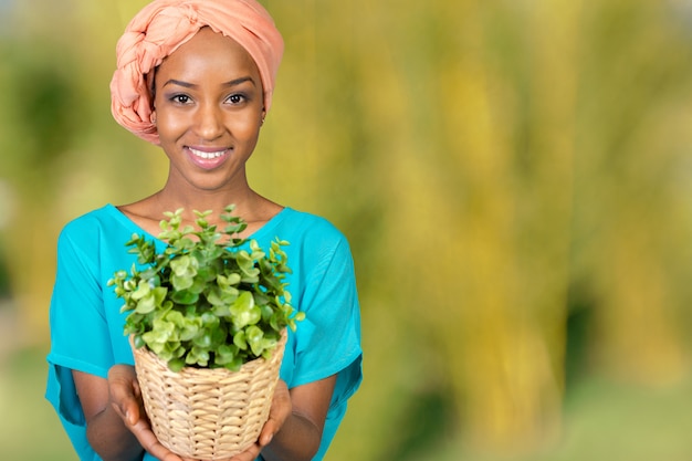 Africaine, femme, tenue, plante, dans, vase