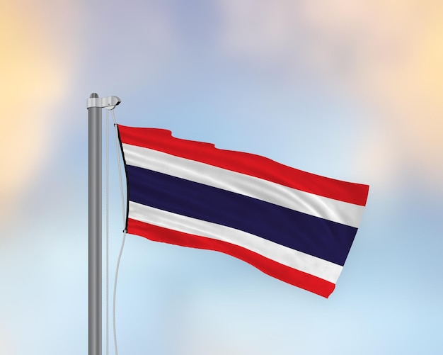 Agitant le drapeau de la Thaïlande sur un mât de drapeau