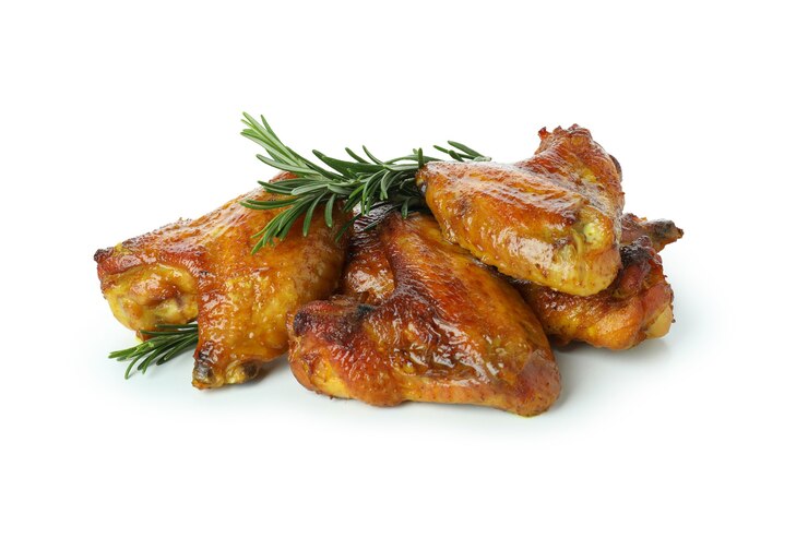 Photo ailes de poulet au four isolé sur fond blanc