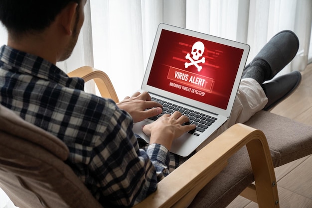 Photo alerte d'avertissement de virus sur l'écran de l'ordinateur détecté un virus informatique et un logiciel malveillant de pirate informatique à la mode