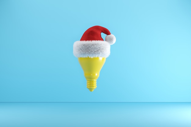 Ampoule jaune avec Bonnet de Noel flottant sur bleu