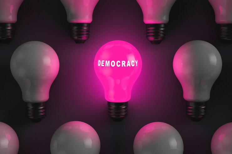 Photo ampoule rougeoyante avec l'inscription démocratie. système d'état démocratique. sujets politiques