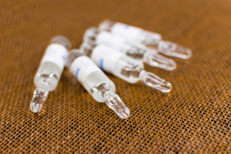 Photo ampoules médicales sur fond marron