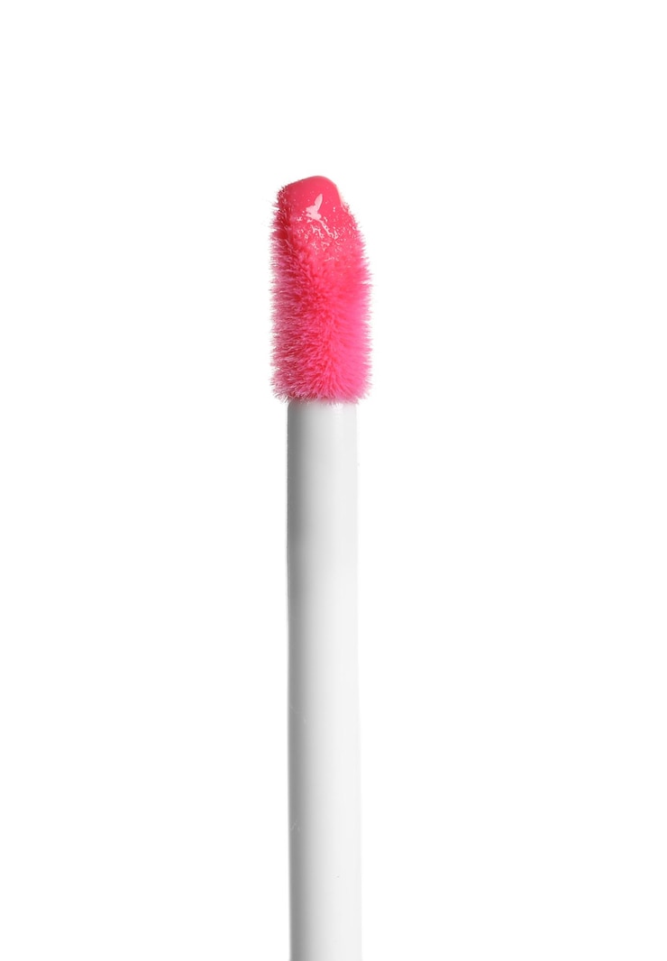 Photo applicateur avec rouge à lèvres liquide isolé sur blanc