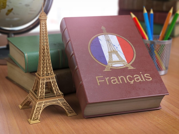 Photo apprendre et étudier le concept français livre avec drapeau français et tour eiffel sur la table