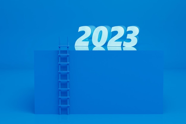 l'approche de la nouvelle année 2023. un escalier au sommet du piédestal bleu sur lequel le 2023