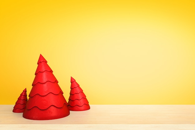 Arbre de Noël sur une table en bois devant fond jaune