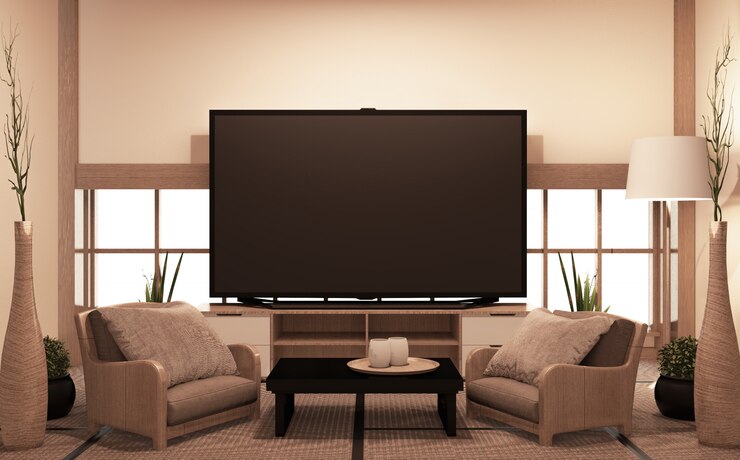 Photo armoire en bois avec tv dans la chambre avec fauteuils