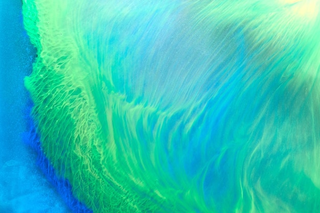 Arrière-plan abstrait couleur verte Art fluide multicolore Vagues éclaboussures et taches Peintures à l'encre d'alcool acrylique sous l'eau