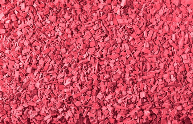 Photo arrière-plan en bois avec la texture des copeaux de bois peints dans la couleur de 2023 viva magenta