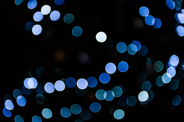 Arrière-plan brillant flou avec lumières bleues et bokeh