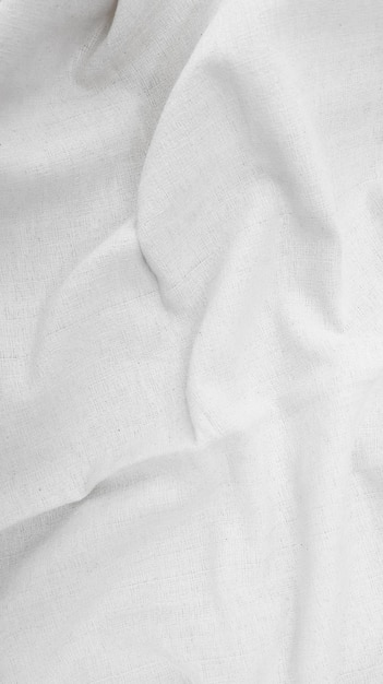 Arrière-plan en coton de tissu toile de lin blanche tissu de coton naturel froissé toile de coton naturelle faite à la main toile de top vue d'arrière-plan textile écologique biologique texture de lin de tissu blanc