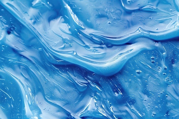 Arrière-plan de désinfectant pour les mains en gel bleu avec un échantillon de crème transparente