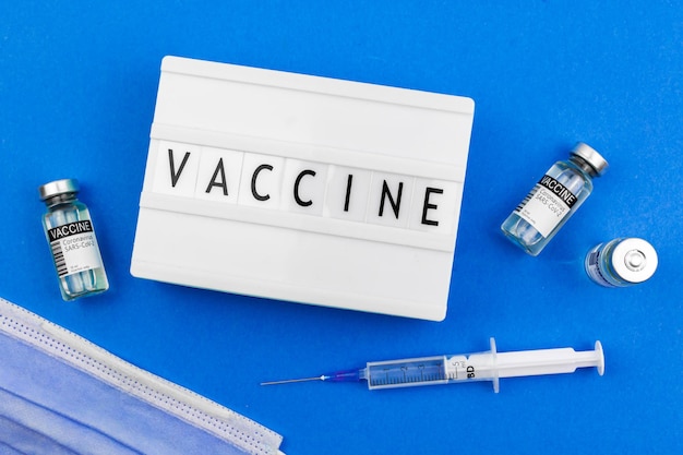 Arrière-plan du concept de vaccin avec inscription de texte et message, photo de vaccination de soins de santé et de guérison