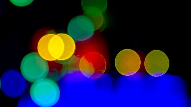 Photo arrière-plan flou abstraction de lanternes colorées et décorations bokeh texture de lumières colorées de la rue