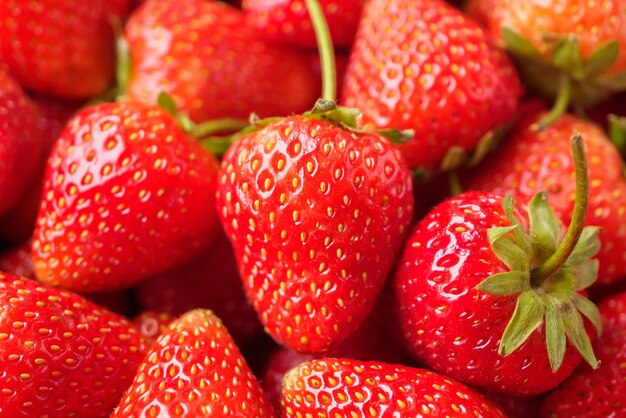 Photo arrière-plan de fraises rouges biologiques fraîches