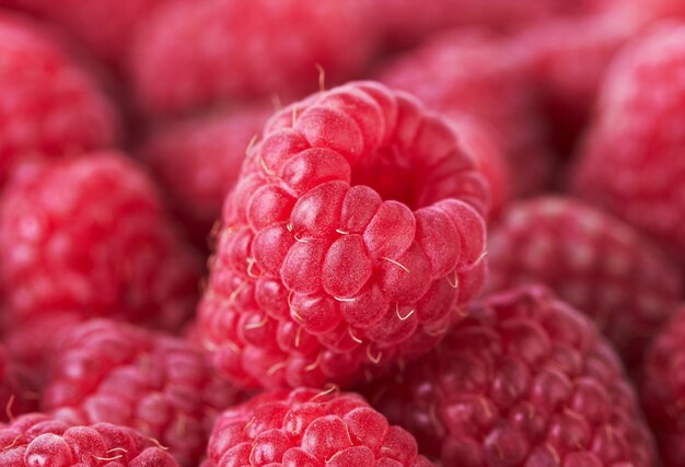 Photo arrière-plan en gros plan des framboises douces