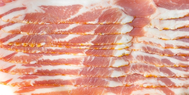 Arrière-plan macro de morceaux de bacon haché fond de nourriture savoureuse