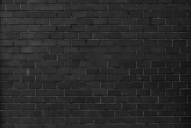 Arrière-plan de mur en briques noires à la texture urbaine élégante