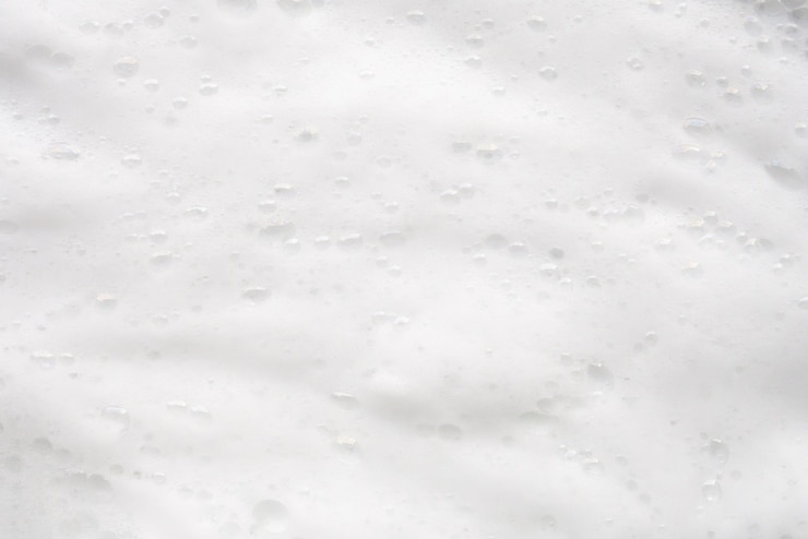 Photo arrière-plan de la texture des bulles de mousse de savon blanc abstrait