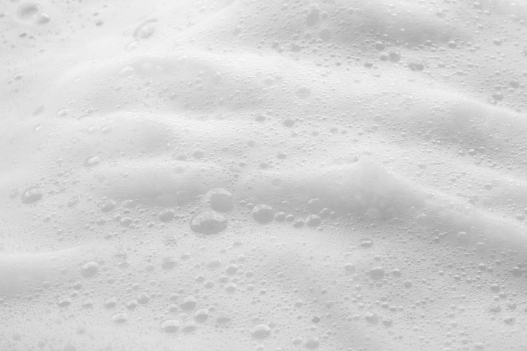 Photo arrière-plan de la texture des bulles de mousse de savon blanc abstrait