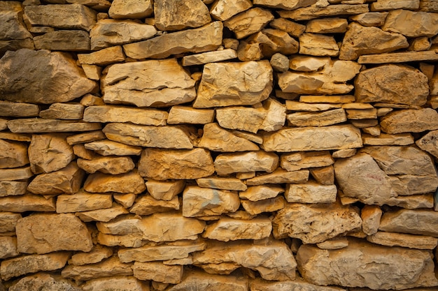 Arrière-plan de la texture du mur de pierre de l'architecture dans la vieille ville de Vela Luka, île de Korcula en Croatie