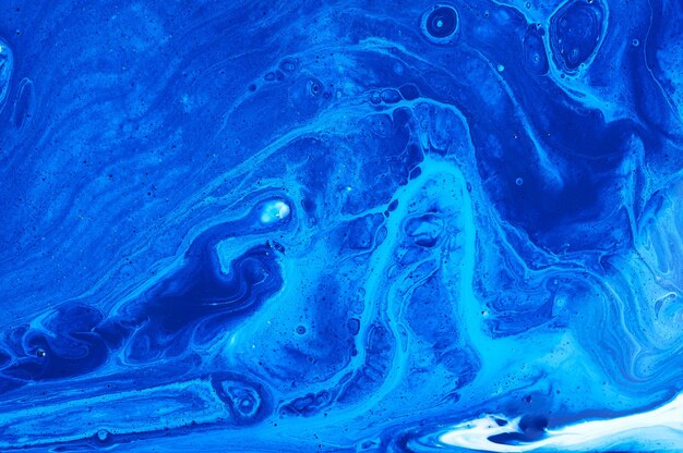 Arrière-plan à texture de marbre abstrait à l'encre liquide bleue