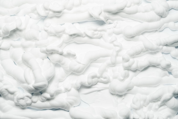 Photo art abstrait de texture mousse blanche. surface d'effet de mousse de rasage appliquée avec des nuances de gris.