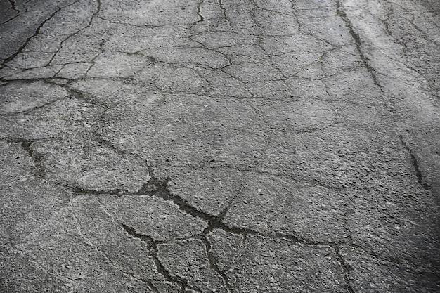 asphalte dans la texture des fissures / fond abstrait fissures sur la route goudronnée