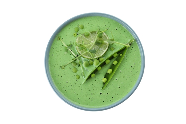 Assiette de soupe aux pois isolé sur une surface blanche