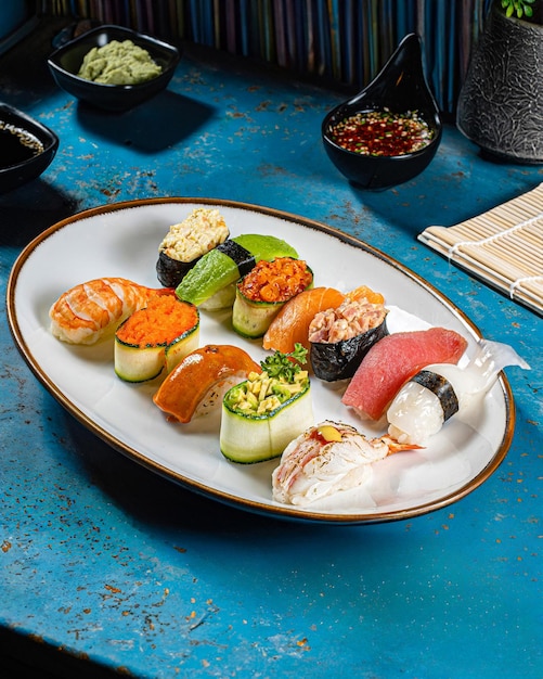 Photo une assiette de sushi nigiri avec une variété de saveurs différentes