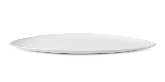 Photo une assiette vide sur une table sur un fond blanc.