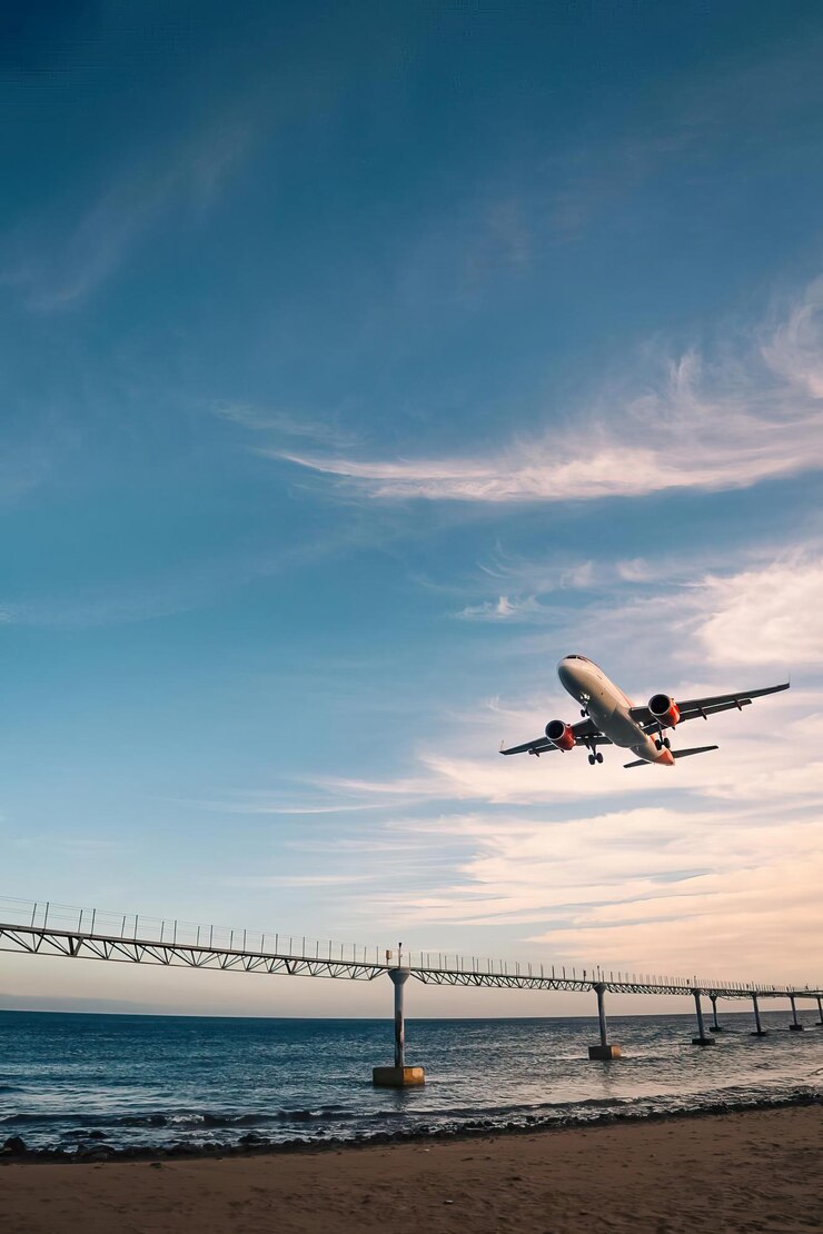 Photo un avion survole un pont avec le mot air sur le côté