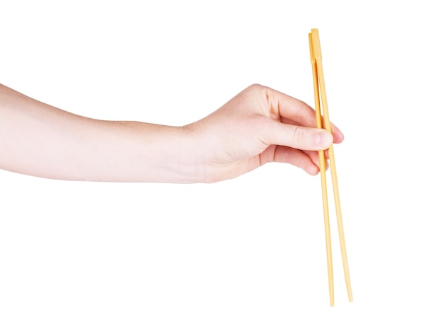 Baguettes avec la main sur un fond blanc isolé