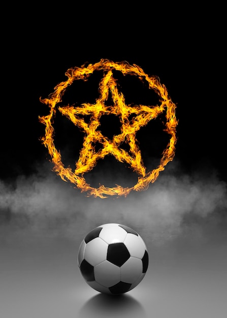 Ballon de football et anneau de feu sur fond de fumée noire