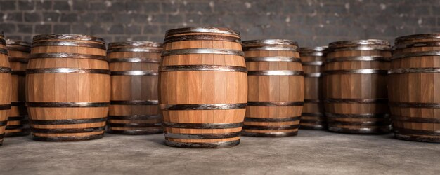 Barrels en bois dans la cave arrière-plan espace vide sur le baril pour la publicité Vieux barils en bois avec du vin dans la voûte du vin bannière large