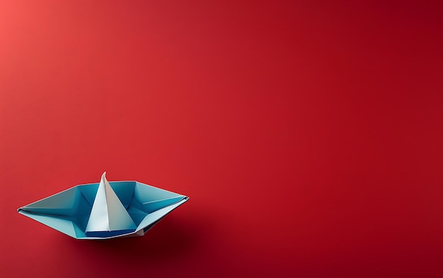 Photo un bateau de papier avec un bateau en papier sur un fond rouge