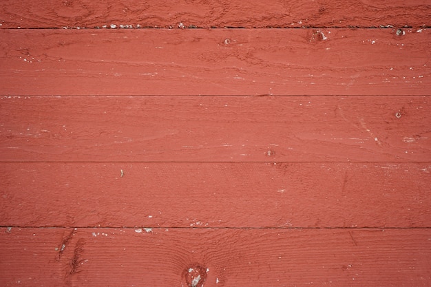 Beau fond en bois. Partie d'une maison en bois de couleur rouge.