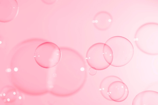 Beau fond transparent de bulles de savon rose