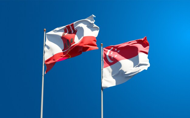 Beaux drapeaux nationaux de Gibraltar et de Singapour ensemble