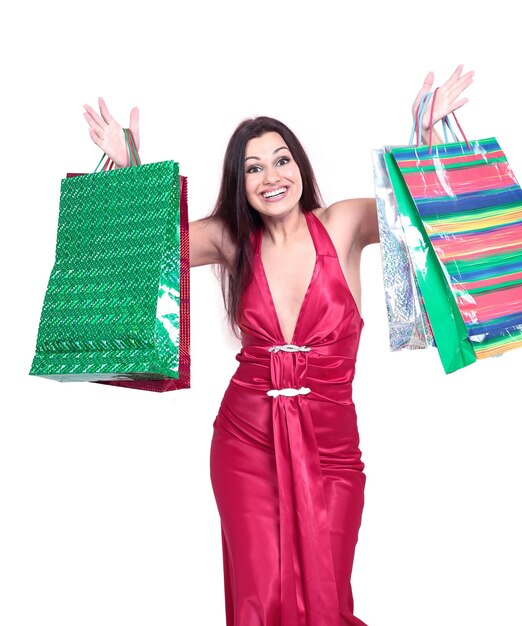 Belle femme avec des sacs à provisions pour les achats de Noël