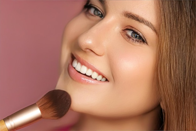 Belle jeune femme appliquant un produit cosmétique en poudre avec une brosse de maquillage en bambou beauté maquillage et soins de la peau modèle visage portrait sur fond rose