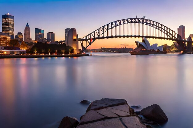 Une belle photo du pont du port de Sydney avec un ciel rose clair et bleu