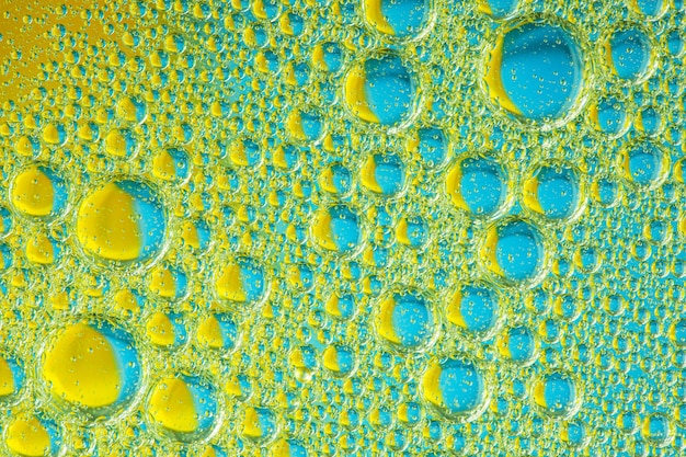 Bleu psychédélique et jaune huile et eau abstrait abstrait coloré mousse
