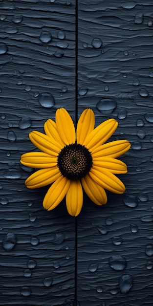 Photo bloc de bois bleu avec des gouttes d'eau et une fleur jaune