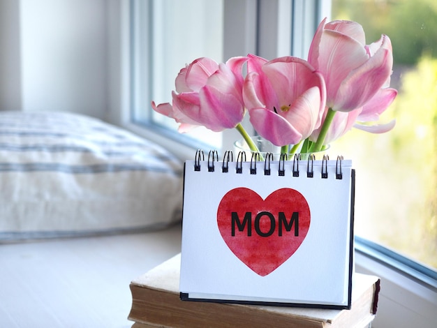 Photo un bloc-notes avec le mot mammie carte de vœux